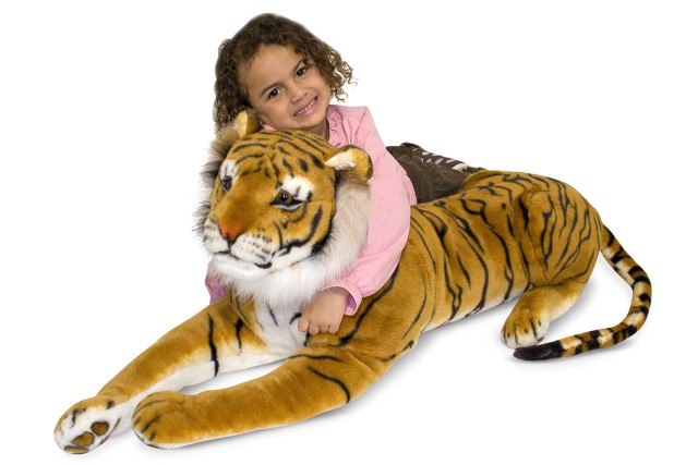 дитина з іграшковим тигром